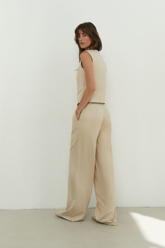 Palazzo pants with a low fit in sand color photo 2