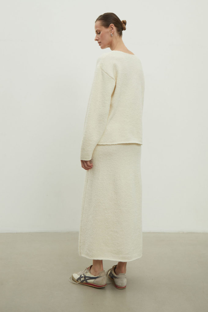Midi knitted skirt with a straight cut in milky color photo 3