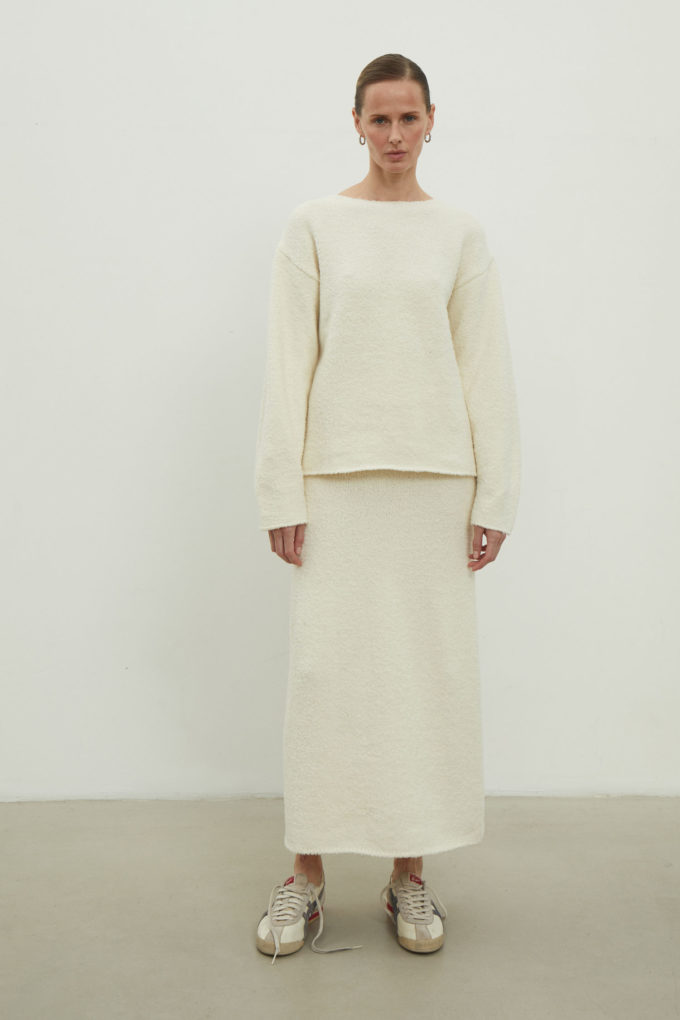 Midi knitted skirt with a straight cut in milky color photo 2