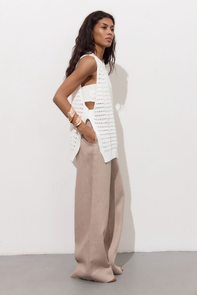 Knitted openwork top with slits in milk photo 2