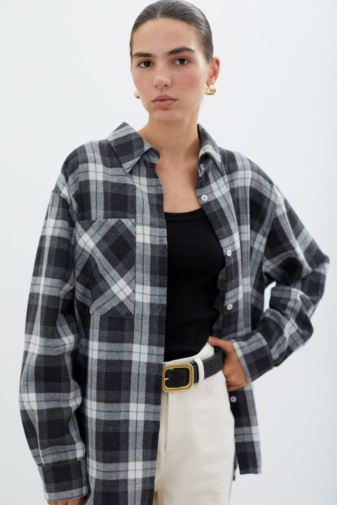 Black shirt with patch pocket in a white check photo 2