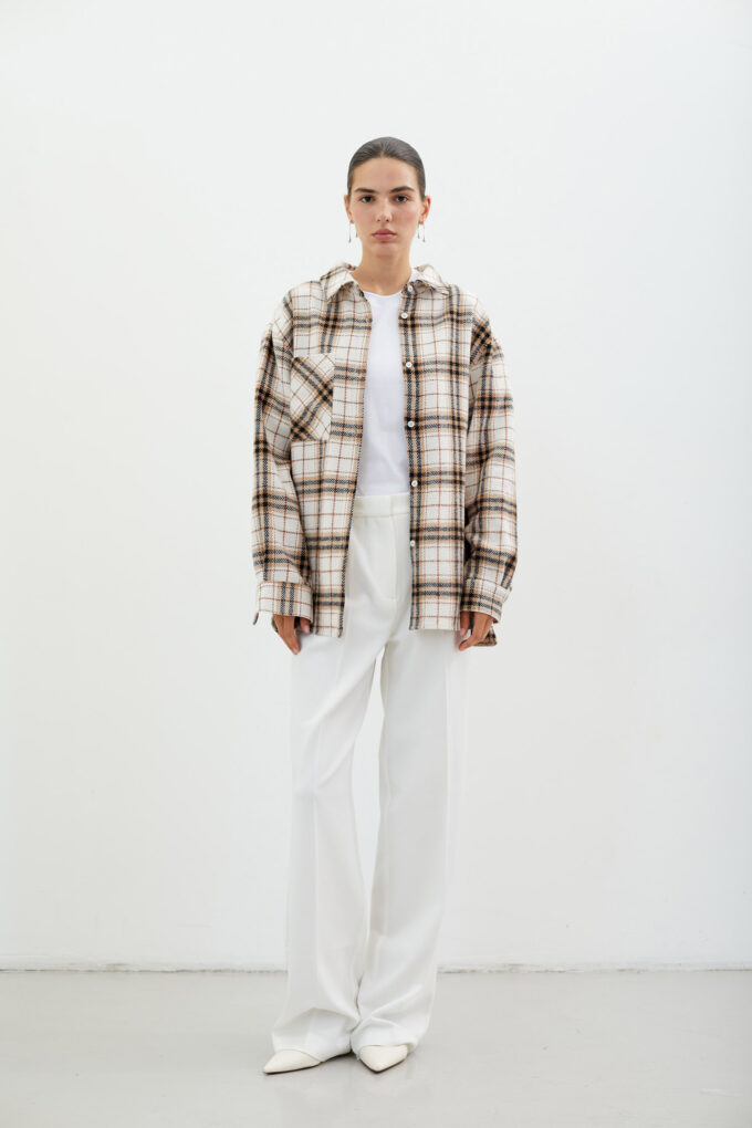 Сheckered warmed shirt with a patch pocket in beige color photo 2