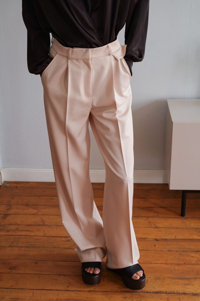 Cream palazzo pants with decorative flap photo 2